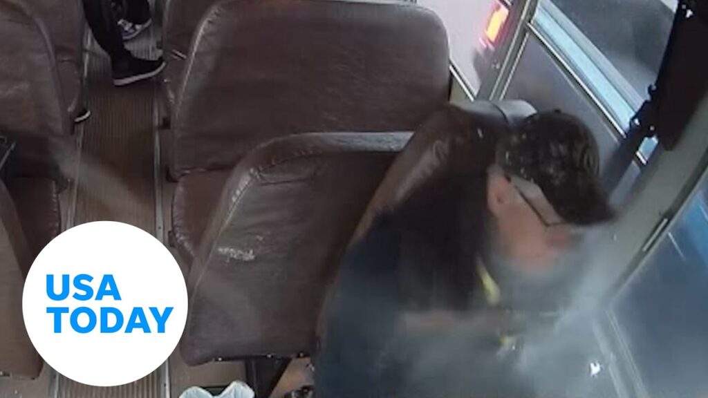 Watch: School bus driver struck by metal bar | USA TODAY