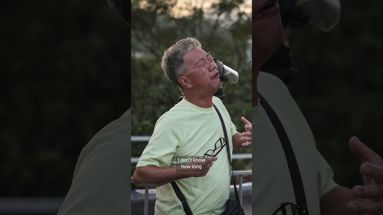 The family tragedy behind the viral photo of the Hong Kong fire | REUTERS