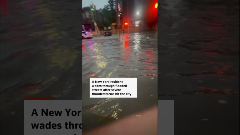 New Yorker wades through flooded streets after thunderstorms