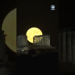 Strawberry full moon rises over Temple of Poseidon in Greece | #shorts #fullmoon