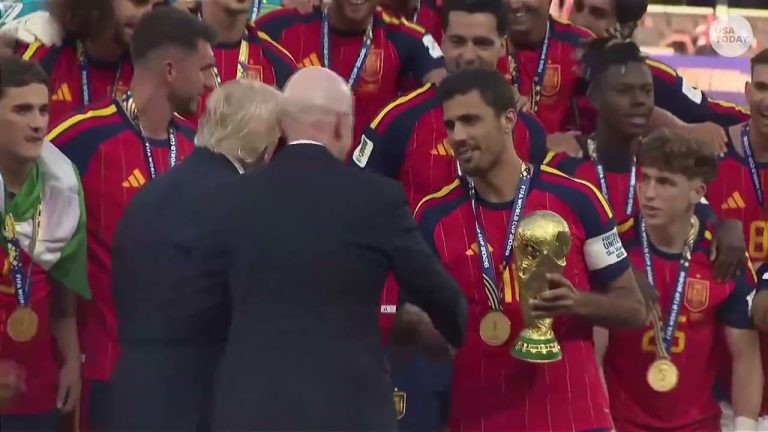 Trump booed at World Cup as he presents Spain FIFA trophy, then lingers for lifting ceremony